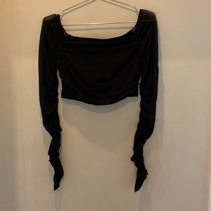 The sleeves are mesh and see through but the torso part isn’t see through